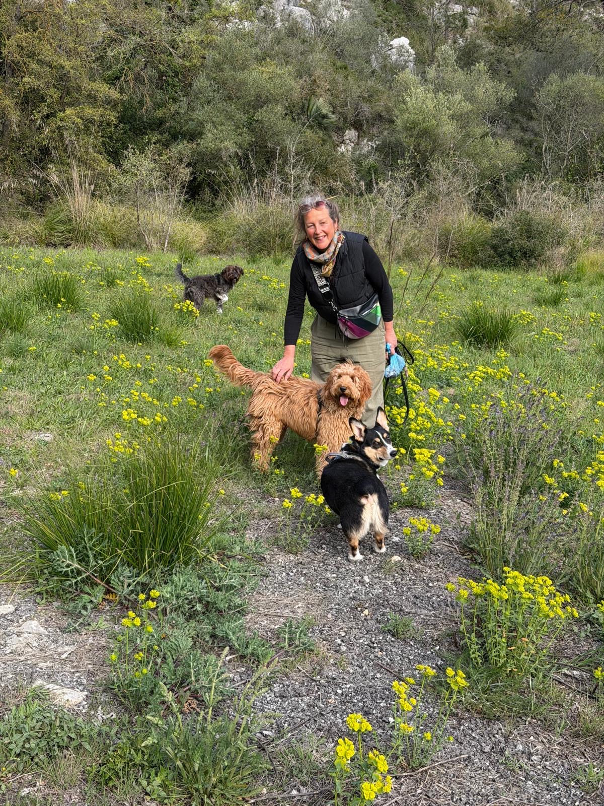 Walking a dog along a coastal trail near Sitges